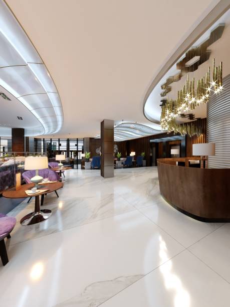 istock Reception area in a modern hotel with wooden reception counters and large pendant gilded chandeliers. 1087508168