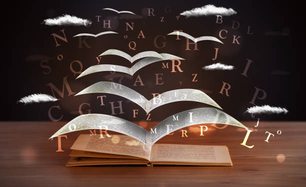 istock Pages and glowing letters flying out of a book 1087508596