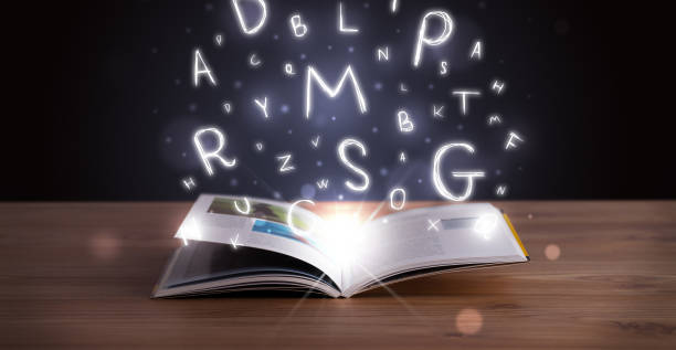 istock Open book with glowing letters flying out 1087508654