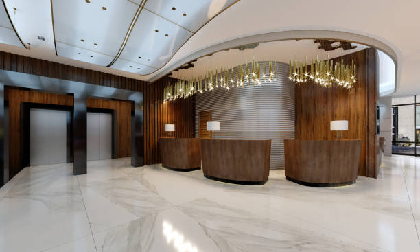 istock Reception area in a modern hotel with wooden reception counters and large pendant gilded chandeliers. 1087508782