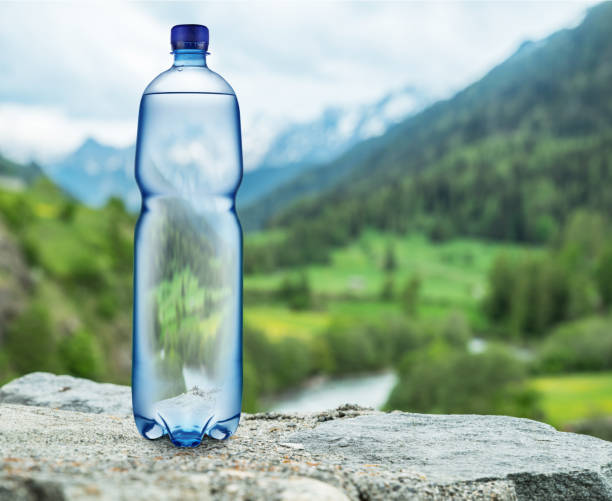 istock Bottle of water on the stone. 1087510506