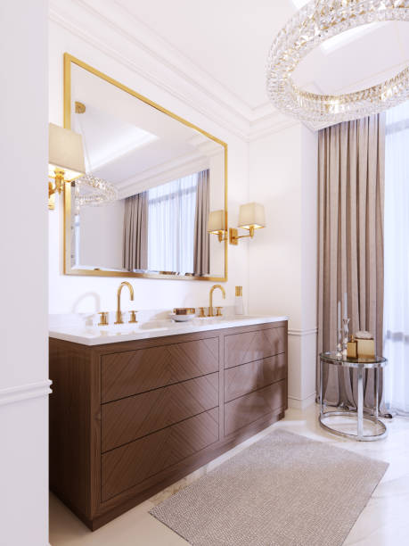 istock Modern wooden vanity with a mirror in a gold frame and sconces on the wall, a low table with decor and a rug with a chandelier. 1087511664