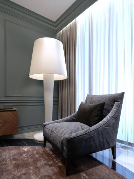 istock Comfortable chair with a large white floor lamp in the room. 1087513530