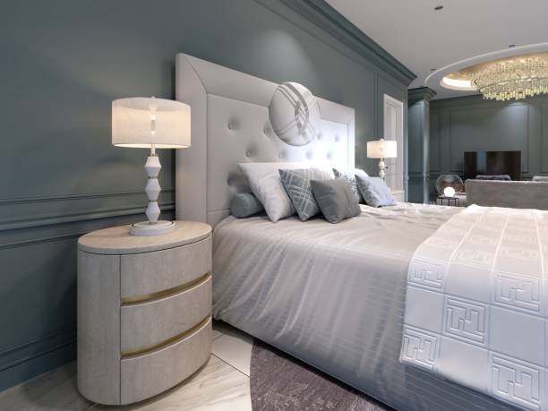 istock Elegant bedroom interior with large comfortable bed and sofa with dressing table. 1087515160