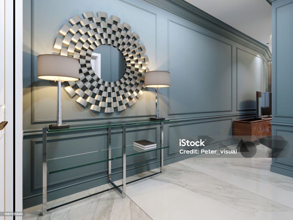 The Corridor In The Apartment With A Modern Metal Console With Glass Shelves And Luminous Lamps And A Round Mirror On The Wall Hall Corridor Interior Design With Blue Walls And White The Corridor In The Apartment With A Modern Metal Console With Glass Shelves And Luminous Lamps And A Round Mirror On The Wall Hall Corridor Interior Design With Blue Walls And White
