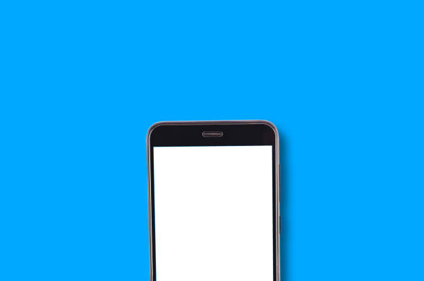 istock Single black smartphone with isolated blank white screen on blue background with copy space for your text. Top view 1087517564