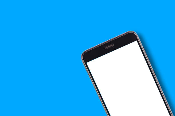 istock Single black smartphone with isolated blank white screen on blue background with copy space for your text. Top view 1087517568