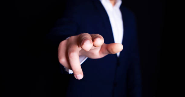 istock businessman finger screen to tell 1087518018