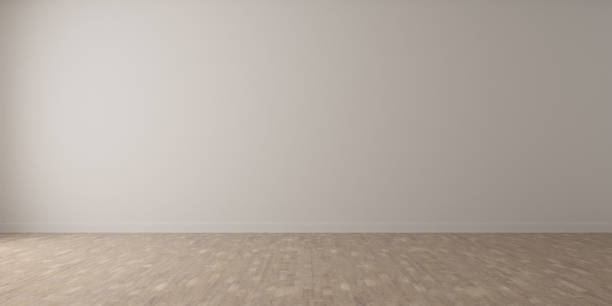 istock 3D stimulate of white room interior and wood laminate floor with sun light cast gradient of shadow on the wall,Perspective of minimal design architecture. 1087524080