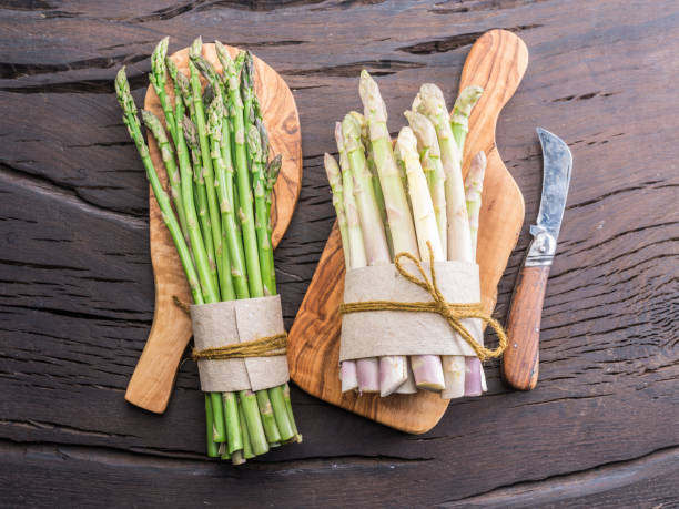 istock Green and white types of asparagus sprouts. 1087526638