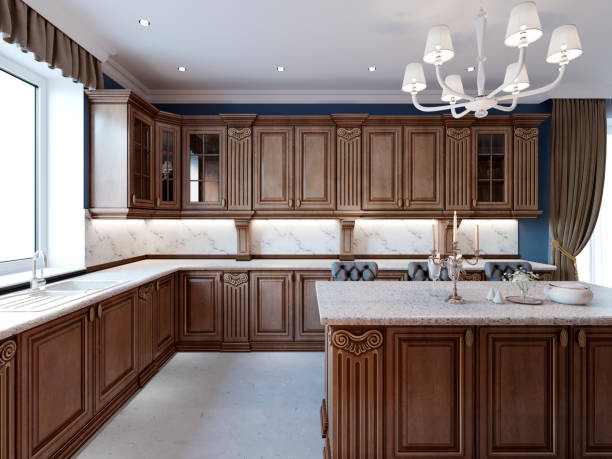 istock Luxury kitchen with tile floor, stained cabinets and marble counter top. 1087528982