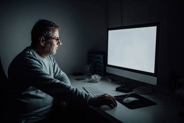 istock Mature man working all night at the office 1087529280
