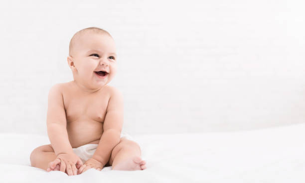 istock Cute baby sitting on white background, copy space 1087531542