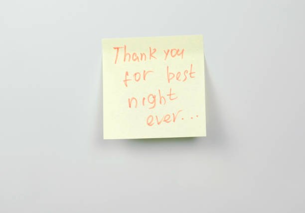istock Note on yellow sticker paper sheets with words thank you for the best night ever. 1087535998