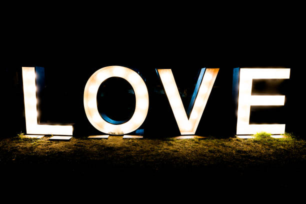 istock black night with the word and text love written in brightly lit letters 1087537110