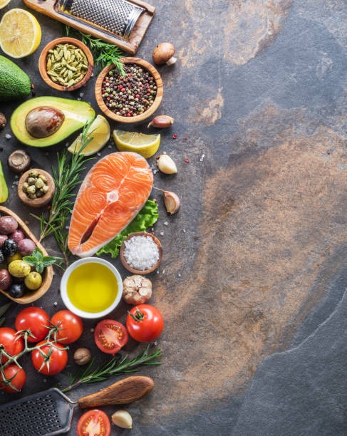 istock Raw salmon with spices and vegetables. 1087539604