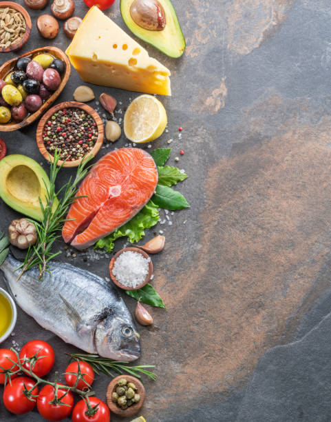 istock Raw dorado fish and salmon steak with spices and vegetables. 1087540104