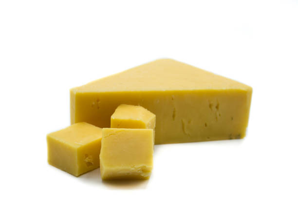 istock Piece of cheddar cheese isolated on white background 1087541302