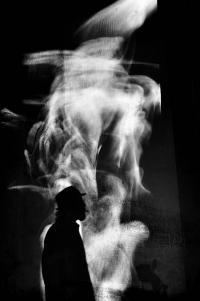 istock Shadow of a man smoking in black and white 1087549654
