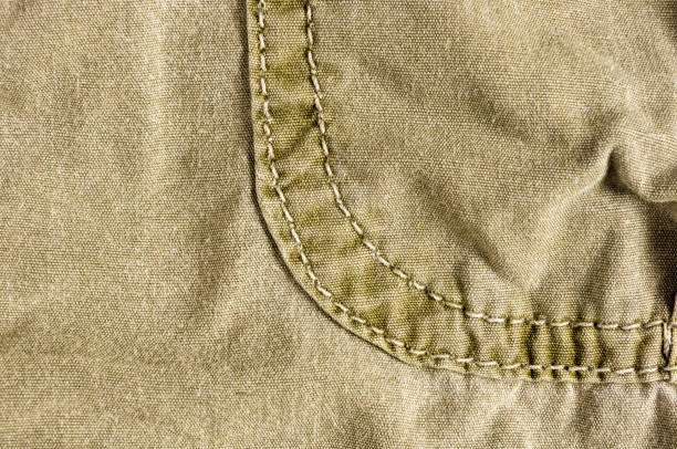 istock clothing items washed cotton fabric texture with seams 1087554782