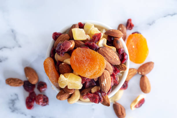 istock healthy snack: mixed nuts and dried fruits 1087560934