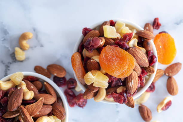 istock healthy snack: mixed nuts and dried fruits 1087560946