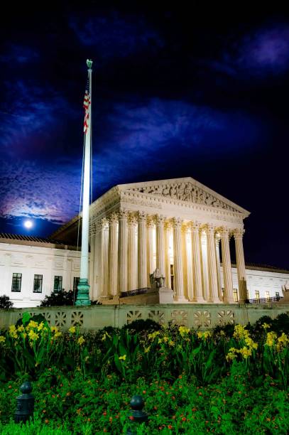 night time long exposure of united states supreme court building in washington dc with full moon and clouds in background - concepts and ideas travel locations architecture and buildings time imagens e fotografias de stock