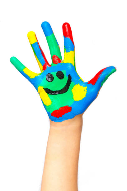 istock Laughing colorful child hand to the right 1087565840