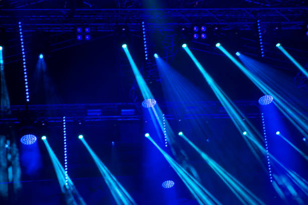 istock Stage lights and spotlights abstract blue bright background 1087568116