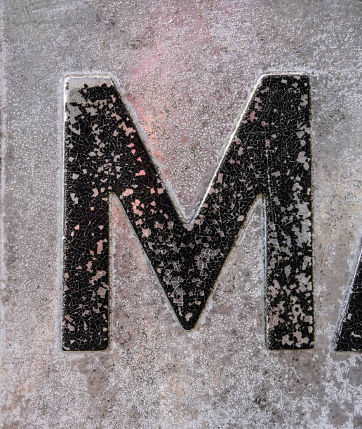 istock Written Wording in Distressed State Typography Found Letter M 1087568282