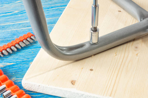 istock Tightening the nut on the stool with a socket wrench 1087570860