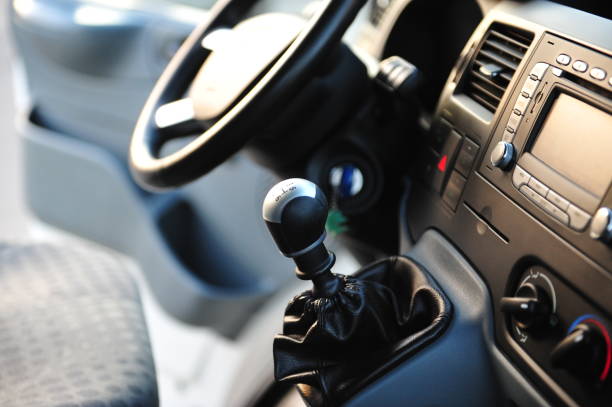 istock Modern luxury prestige car interior, dashboard, steering wheel. Black perforated leather interior. 1087572276