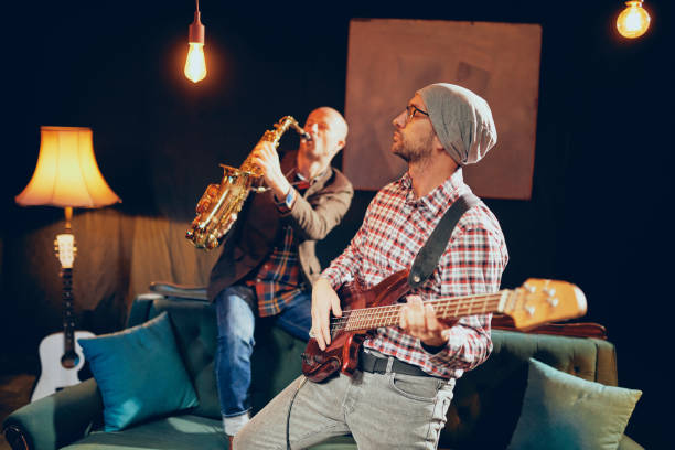 istock Two very talented musicians having rehearsal in home studio. 1087574640