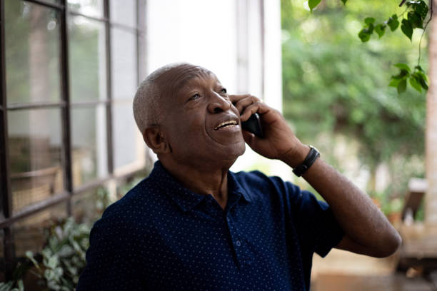 Afro Senior Man Using His Mobile Phone