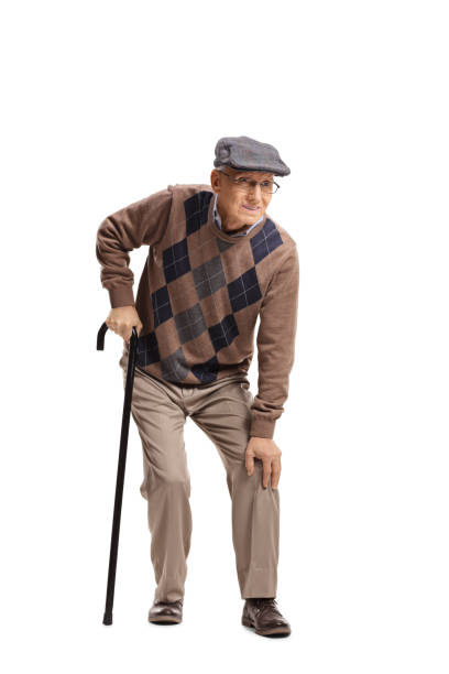 istock Senior man with a knee pain walking with a cane 1087574758