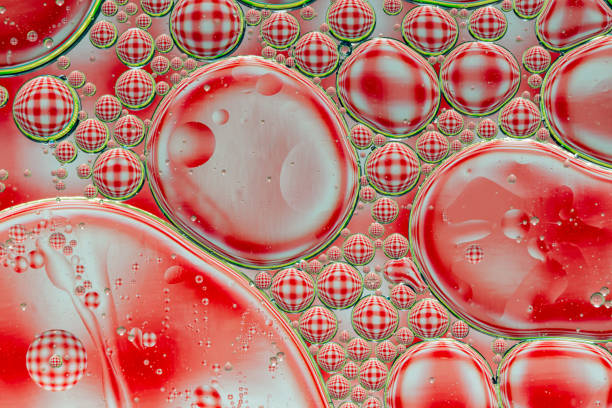 istock Abstract background of red oil drops on water 1087575462
