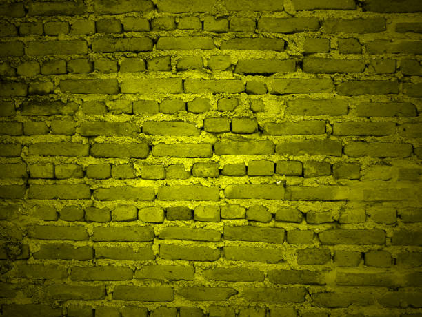 istock yellow background of brick wall texture 1087577194