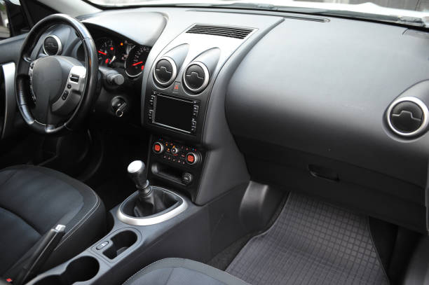 istock Modern luxury prestige car interior, dashboard, steering wheel. Black perforated leather interior. 1087578268