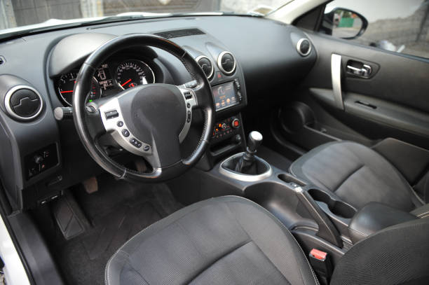 istock Modern luxury prestige car interior, dashboard, steering wheel. Black perforated leather interior. 1087578282