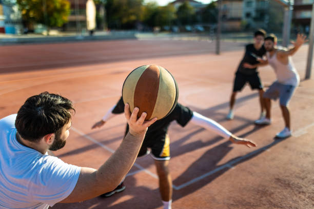 istock Young Men Playing Streetball 1087581108