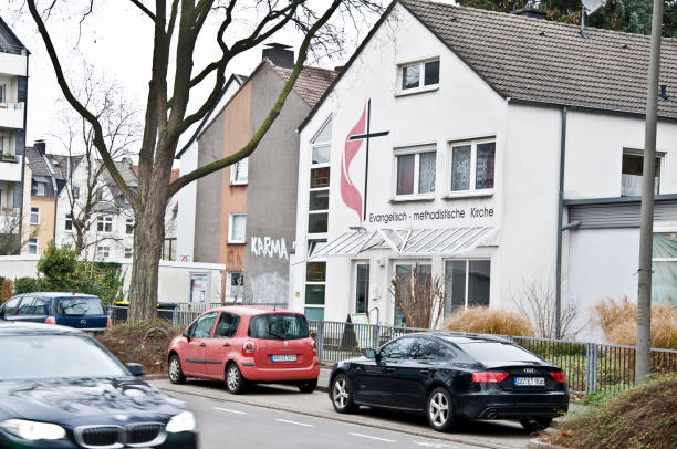 Cars parked outside Evangelisch Methodistiche Kirche (Evangelical Methodist Church) in Dortmund - Germany