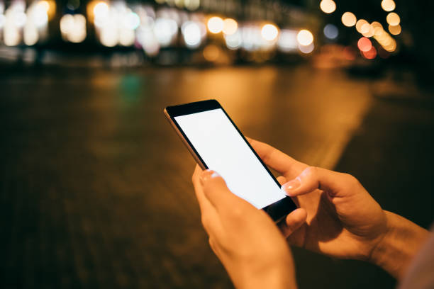 istock Close-up woman's hands holding mobile phone 1087585964