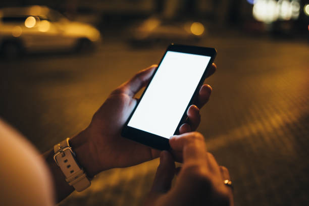 istock Close-up young woman's hands holding mobile phone 1087585994