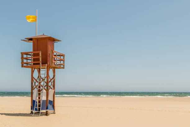 istock Wooden Lifeguard Tower on an empty beach 1087587974