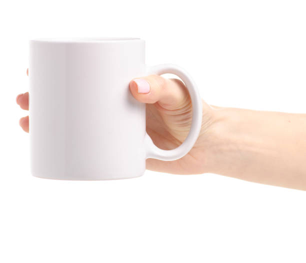 istock White cup mug in female hand 1087596210