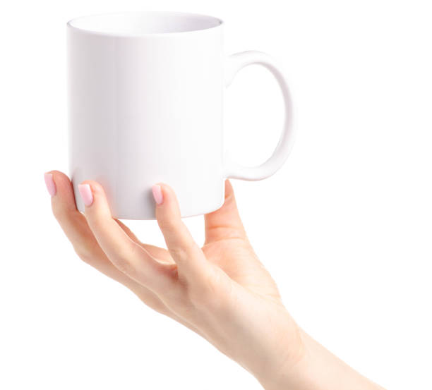 istock White cup mug in female hand 1087596238
