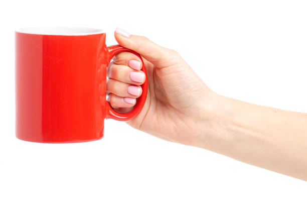 istock Red cup mug in female hand 1087596308