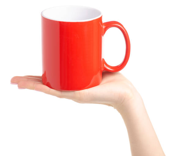 istock Red cup mug in female hand 1087596322