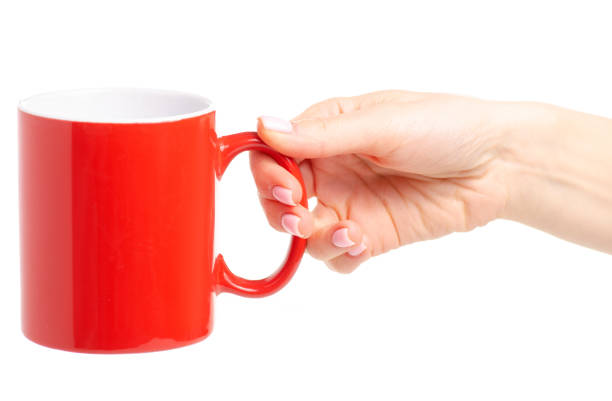 istock Red cup mug in female hand 1087596336