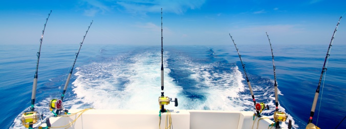boat fishing trolling panoramic rod and reels blue sea wake prop wash